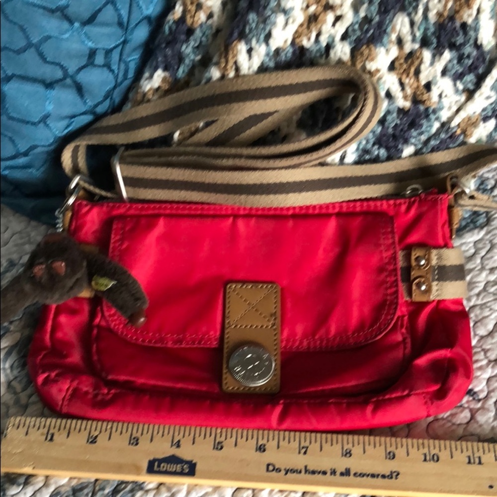 Preowned Kipling Nylon Crossbody in dark red/pink.